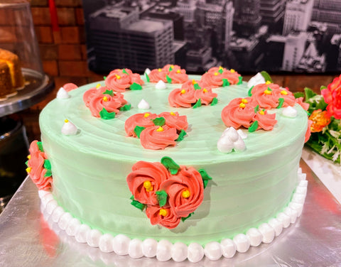 Red Flora On Green Cream Design Cake