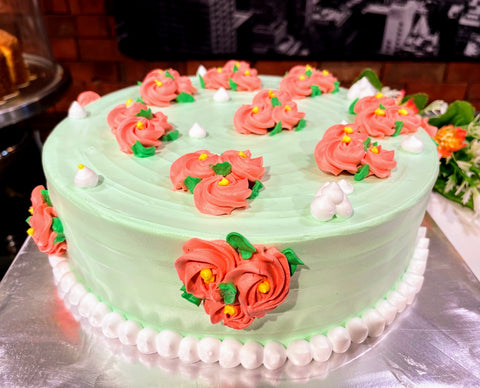 Red Flora On Green Cream Design Cake