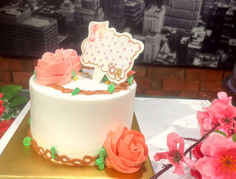 White Cream with Pink Floral Butter and Tag Cream Design Cake